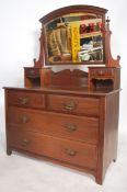 An Edwardian mahogany dressing chest / table being