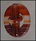 A vintage 20th century Scottish pebble banded oran