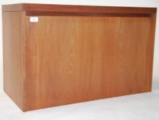 A retro mid century Beaver & Tapley teak wood wall