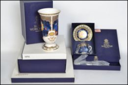 A collection of boxed Royal Worcester Millennium c