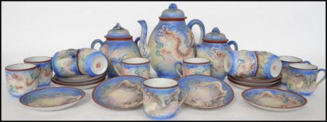 An Oriental ceramic 12 person eggshell tea service