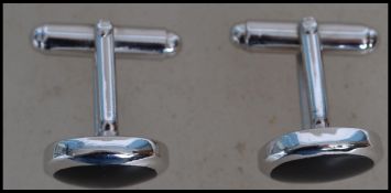 A pair of contemporary gentlemans silver cufflinks