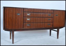 A 1970's teak wood sideboard by Beautility being r