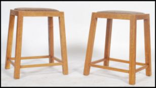 A pair of vintage 20th century wooden oak stools h