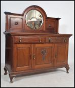 An Edwardian large mahogany mirror back sideboard