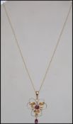 A 9ct gold Art Nouveau style pendant necklace the