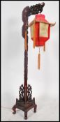An unusual mid century Chinese hardwood dragon sta