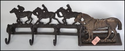 A vintage style cast iron equestrian horse racing