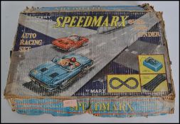 A vintage Speedmarx toy set complete with the original box to include track and cars etc ( please