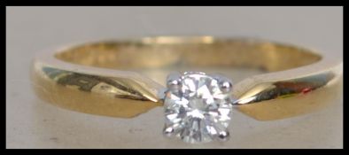 An 18ct yellow gold diamond single stone ladies ri