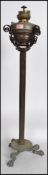 A 19th century brass neo classical oil lamp on sta