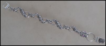 A ladies contemporary silver snake bangle of linke