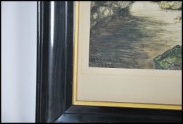 A framed and glazed 19th century painting of a riv