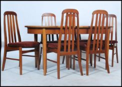 A 1960's retro teak D-end extending dining table,