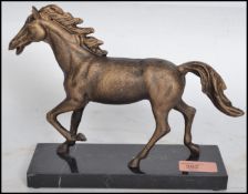 A vintage style cast iron equestrian horse figurin