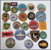 A collection of vintage fishing patch badges to in