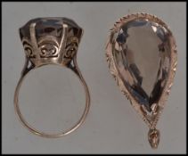 A vintage 9ct gold dress ring set with a round cut