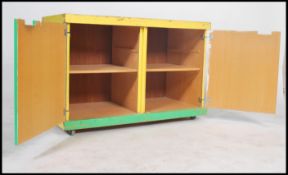 A 20th century Industrial beech wood school cupboa