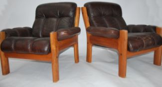 A retro pair of Scandinavian brown leather upholst