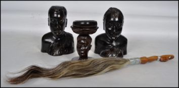 A collection of African tribal wares to include a male and female carved pair of ebony wooden