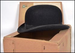 A vintage 20th century ladies hunting bowler hat by Lock and Co London of moleskin construction with