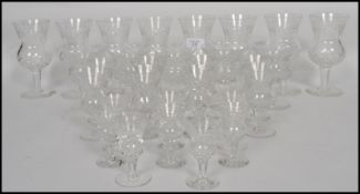 A group of cut lead crystal glass Edinburgh Thistle drinking glasses each raised on plain bases with