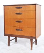 A 1970's retro Danish influence teak wood straight four chest of drawers having an upright