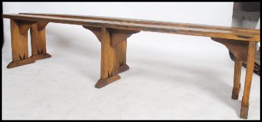 A good pair of 19th century French country pine refectory pig benches. Each with shaped single plank