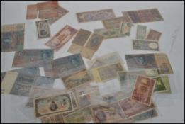 A large collection quantity of vintage 20th century bank notes mostly WW2 related to include,