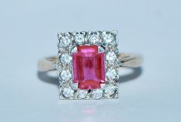A hallmarked 9ct gold pink sapphire and white stone cluster ring.  Size K.5. Weight 3.5g.