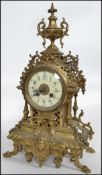 A 19th century brass ormulu 8 day French Empire  mantel clock. The clock with decorative cast