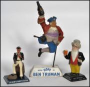 A group of three vintage 20th century breweriania advertising point of sale bar top mascots one