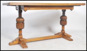 A 20th century oak refectory dining table with rec