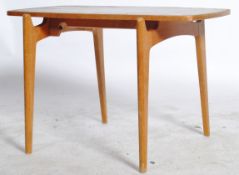 A 1970 Danish inspired teak coffee table with a floating top on raised legs