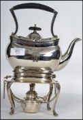 A silver plated 20th century spirit burner kettle raised on stand with claw feet makers stamp to