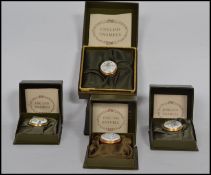 A group of four enamel pill boxes by Halcyon Days complete in original boxes.