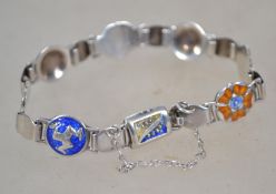 A believed Norwegian / Danish silver and enamel bracelet designed with flower heads in the manner of