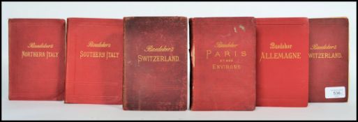 A collection of six 19th century Baedeker guides each with maps to the inners with guides for Paris,
