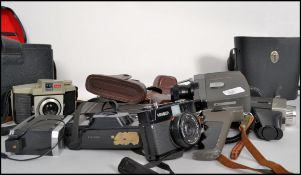 A large collection of vintage 20th century cinematography / photography cameras lenses and equipment
