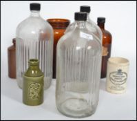A small collection of vintage bottles and jars dating from the late 19th century to include