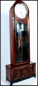 A 20th century large German free standing grandfather clock by Moathe / Mauthe raised on a large