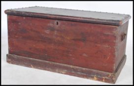 A 19th century pine toolbox / blanket box having a