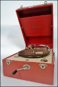 A stunning 1930's red cased Decca picnic gramophone, carry handle to side, front-wind motor, auto-