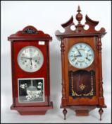 A non matching pair of wooden cased wall clocks to include a 15 day wall clock and a Chinese made 31