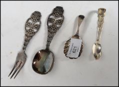 A silver hallmarked caddy spoon with shell shaped