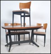 A 1950's retro teak wood dining room suite consisting of a teak extending dining chair raised on