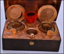 A 19th century Austrian travelling inkwell of gilt metal; construction having two spring action