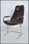 A 1970's Pieff of Worcester chrome and leather cantilever armchair raised on a tubular chrome