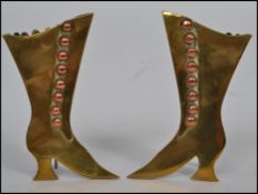 A pair of Victorian brass and copper mounted easel spill vases, each in the form of a lady`s boot,