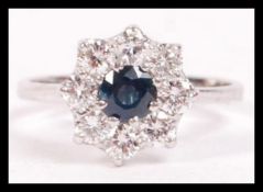 A  14ct white gold, sapphire  and diamond daisy he